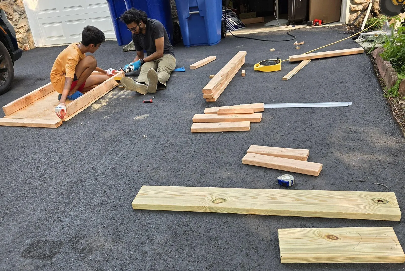 Framing the car on the driveway with lumber spread around