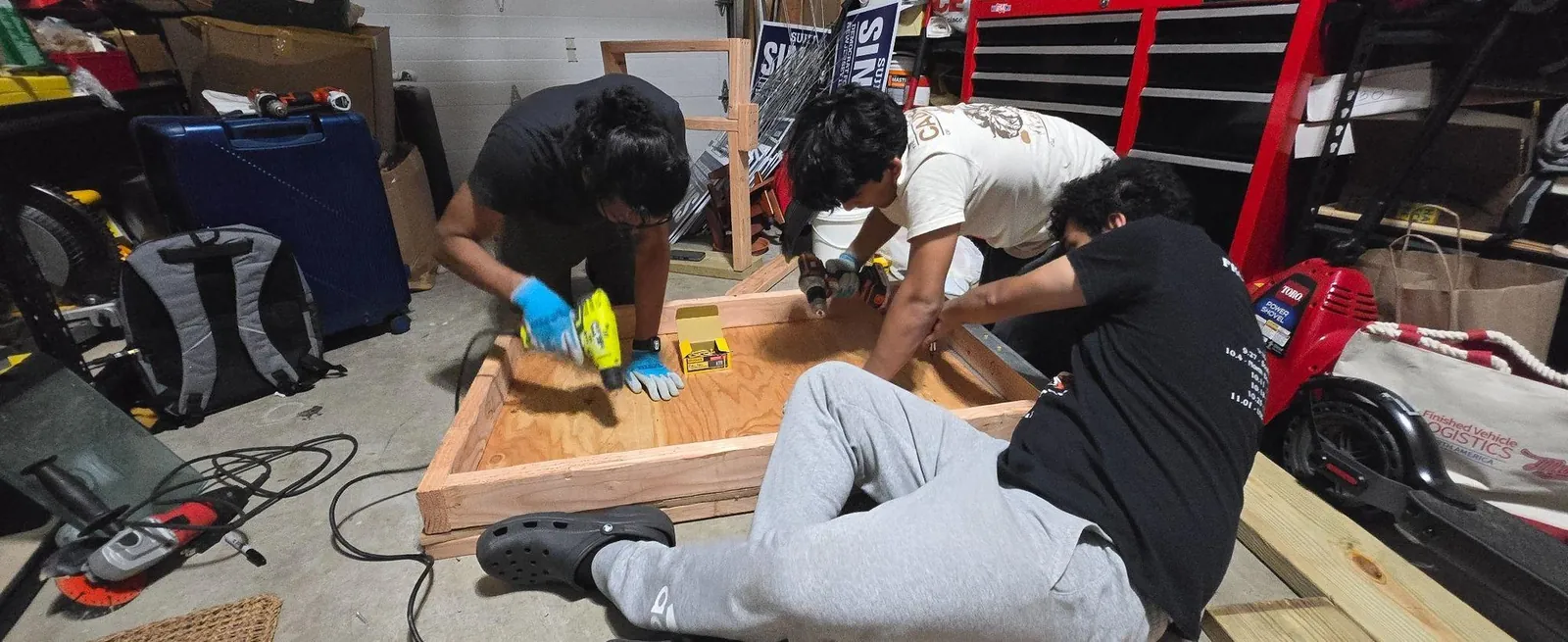 Team drilling into the floor pan frame