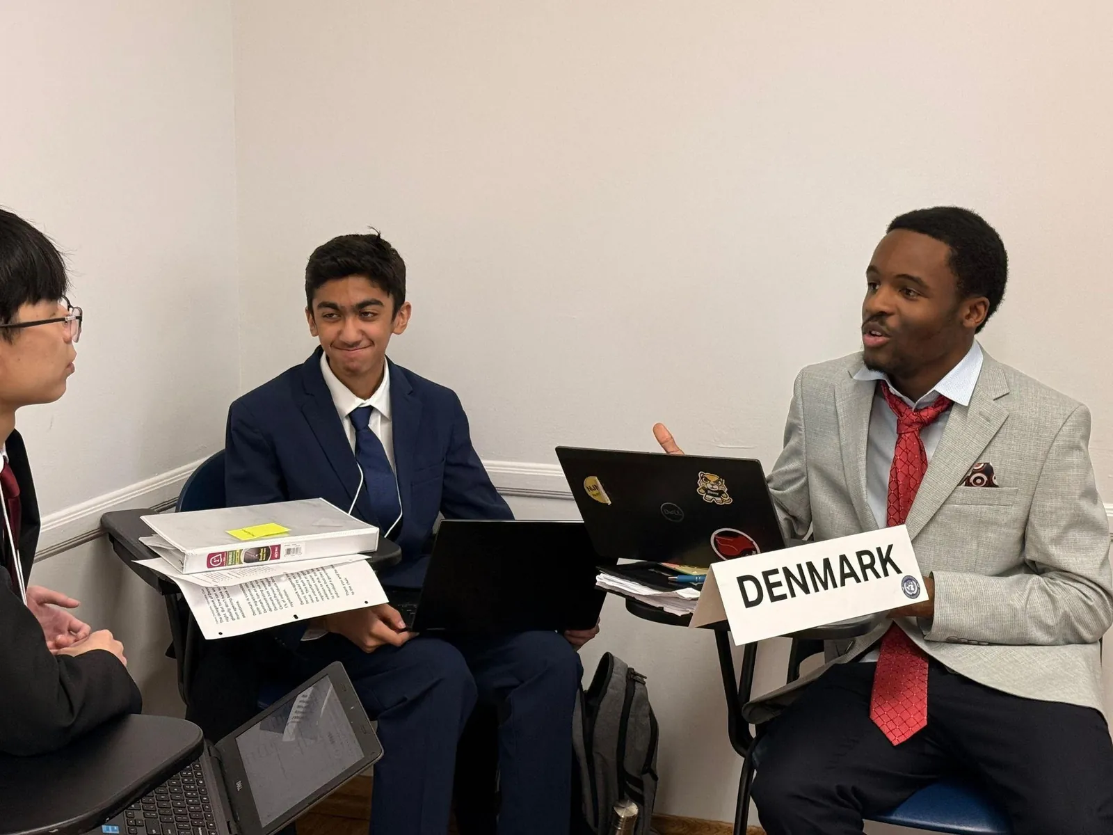 Model UN delegates negotiating in caucus